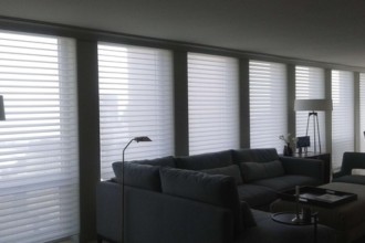 Hunter Douglas Motorized Silhouette with Motorized Roller Shades Behind